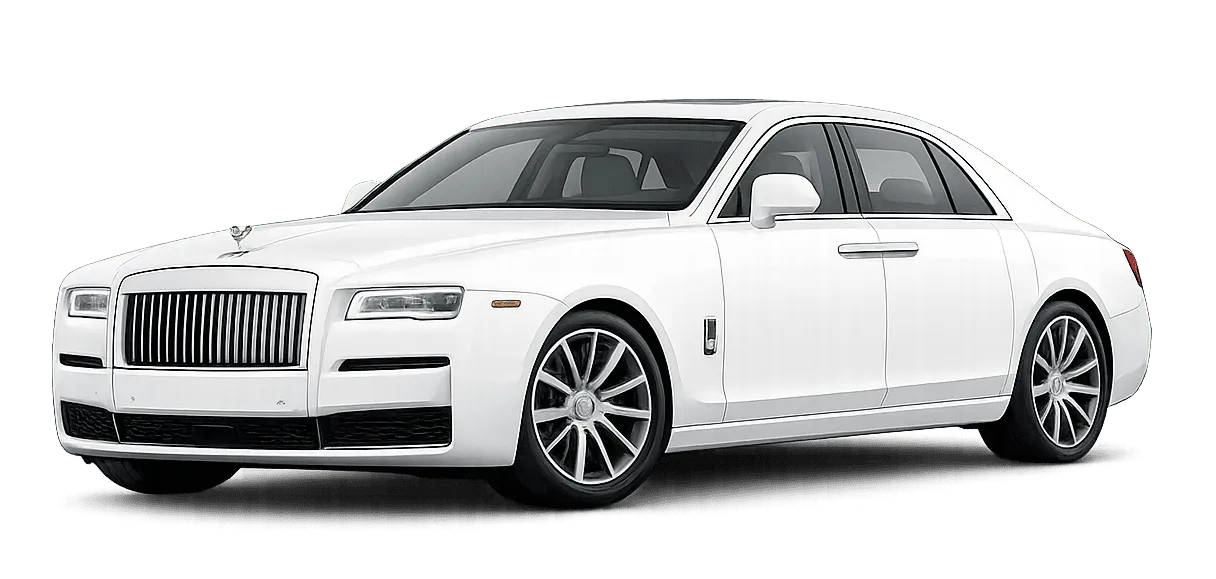 White luxury sedan with a prominent vertical grille and sleek headlights isolated on black background.